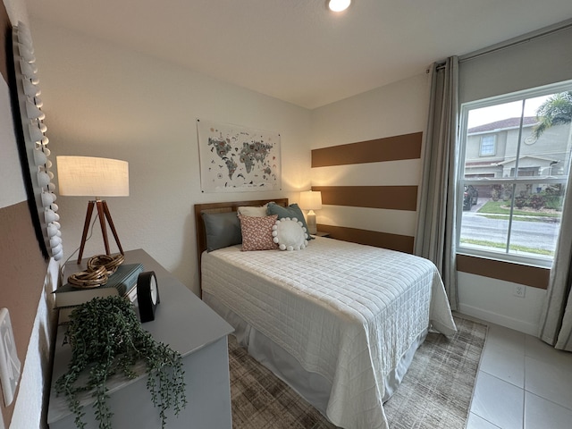 306 Silver Sands Ln Unit 17, Fort Pierce, FL 34945 - bedroom with multiple windows and light tile patterned floors