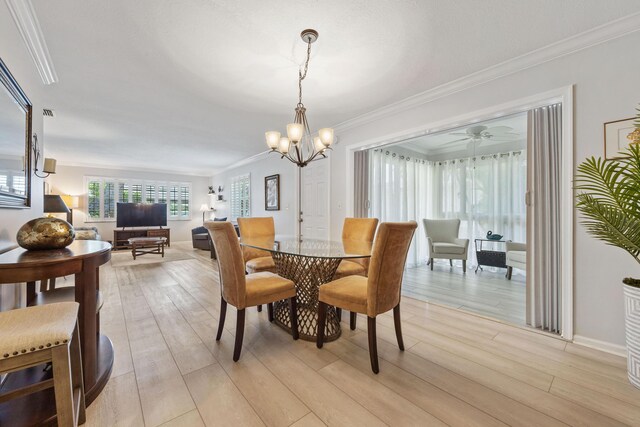 10116 46th Ave S Unit 488, Boynton Beach, FL 33436 - dining area featuring light wood-style floors, a chandelier, and ornamental molding