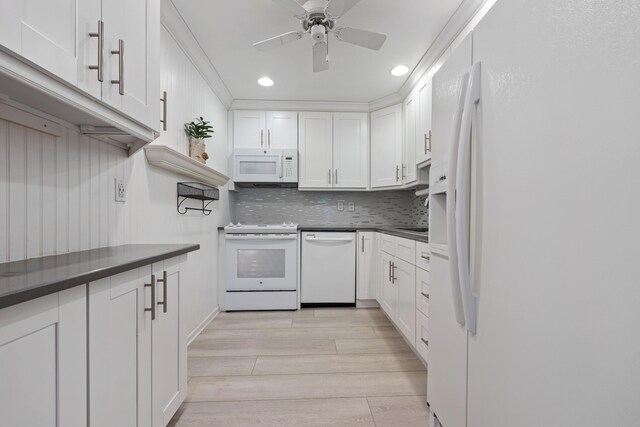 10116 46th Ave S Unit 488, Boynton Beach, FL 33436 - kitchen with white appliances, white cabinetry, dark countertops, light wood-style flooring, and recessed lighting