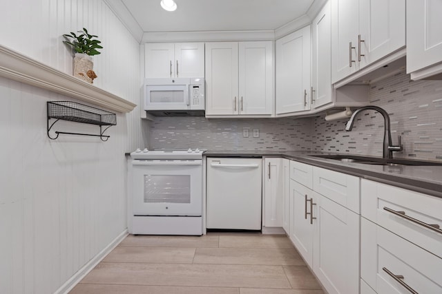 10116 46th Ave S Unit 488, Boynton Beach, FL 33436 - kitchen with white appliances, tasteful backsplash, a sink, dark countertops, and white cabinets