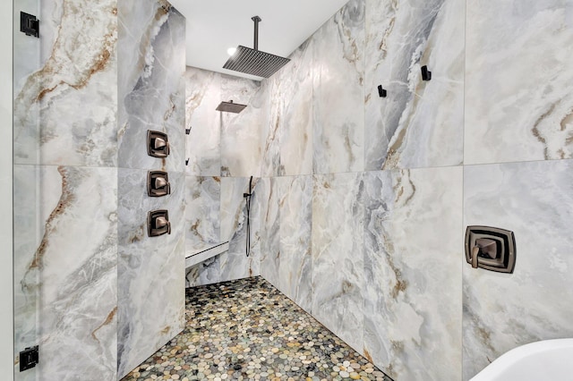 17495 40th Run N, Loxahatchee, FL 33470 - bathroom with a marble finish shower and tile walls