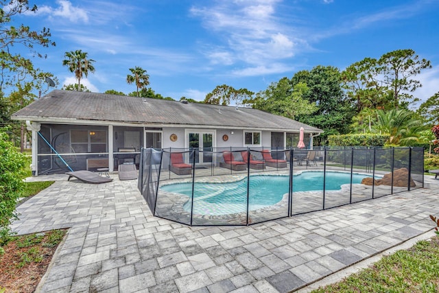 17495 40th Run N, Loxahatchee, FL 33470 - view of swimming pool featuring a patio area and a sunroom