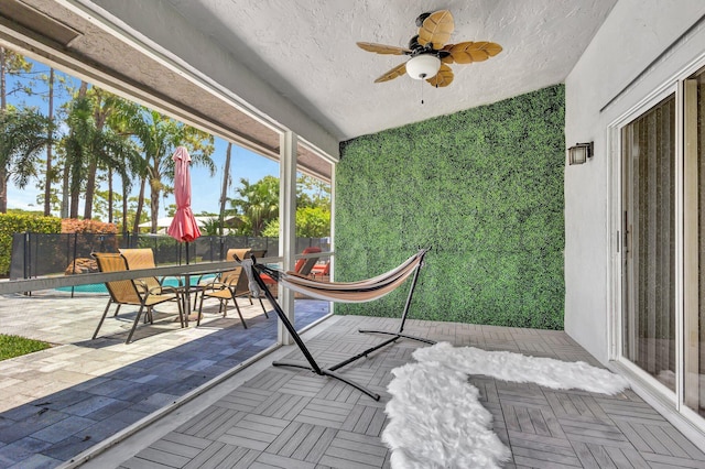17495 40th Run N, Loxahatchee, FL 33470 - sunroom featuring ceiling fan, outdoor dining space, plenty of natural light, and lofted ceiling