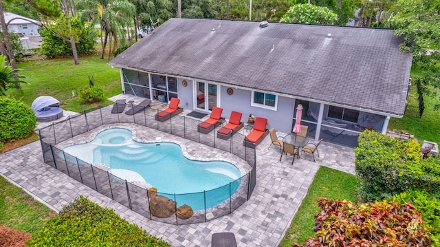 17495 40th Run N, Loxahatchee, FL 33470 - view of swimming pool with a sunroom, a patio, and an in-ground hot tub