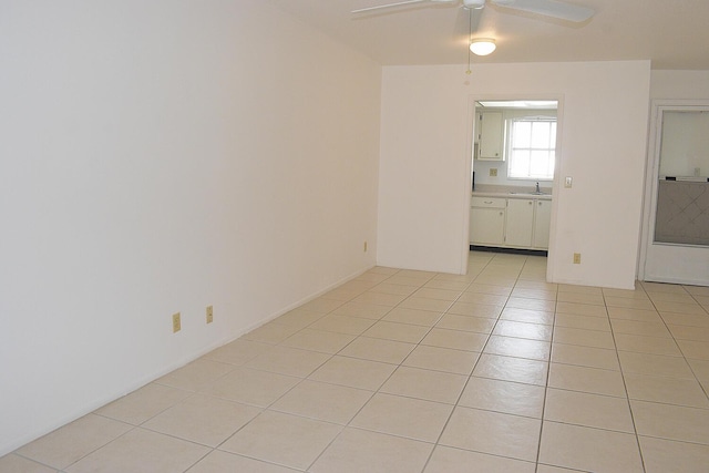 2930 Crosley Dr E Unit G, West Palm Beach, FL 33415 - empty room featuring light tile patterned floors, a ceiling fan, and a sink