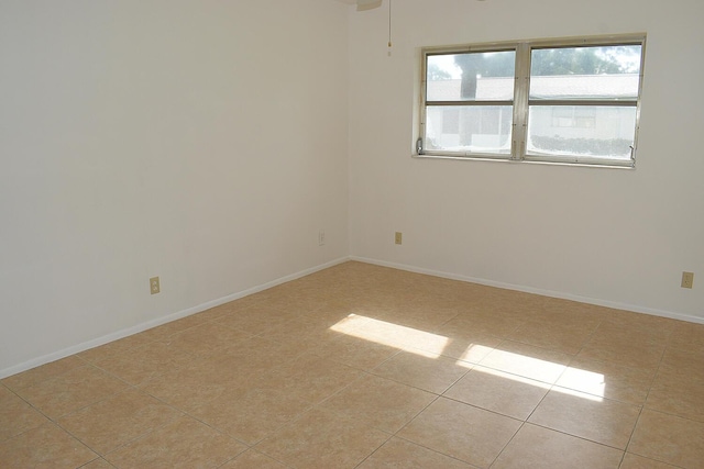2930 Crosley Dr E Unit G, West Palm Beach, FL 33415 - spare room with light tile patterned flooring and baseboards