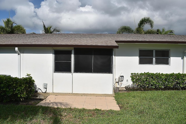 2930 Crosley Dr E Unit G, West Palm Beach, FL 33415 - rear view of property with stucco siding and a shingled roof