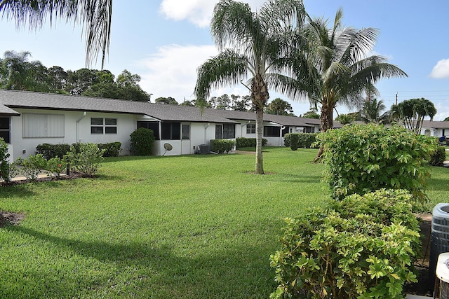 2930 Crosley Dr E Unit G, West Palm Beach, FL 33415 - view of green lawn with central air condition unit