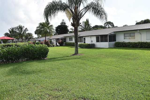 2930 Crosley Dr E Unit G, West Palm Beach, FL 33415 - view of green lawn with cooling unit
