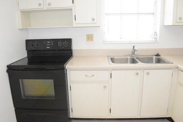 2930 Crosley Dr E Unit G, West Palm Beach, FL 33415 - kitchen featuring black electric range, a sink, light countertops, and open shelves