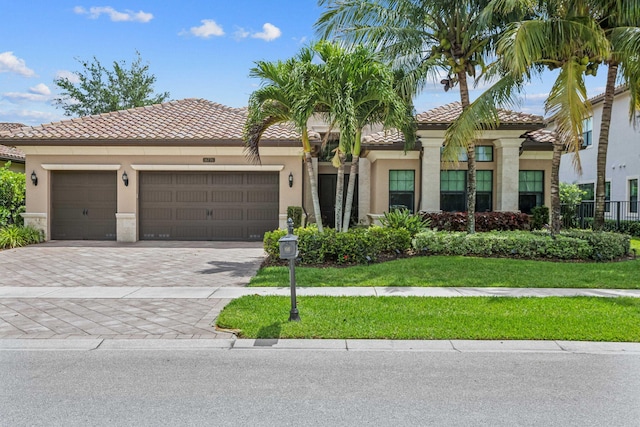 16770 Burlington Bristol Ln, Delray Beach, FL 33446 - mediterranean / spanish-style home with a tile roof, driveway, an attached garage, and stucco siding