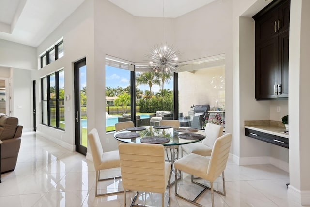 16770 Burlington Bristol Ln, Delray Beach, FL 33446 - dining room with a chandelier, baseboards, and a high ceiling
