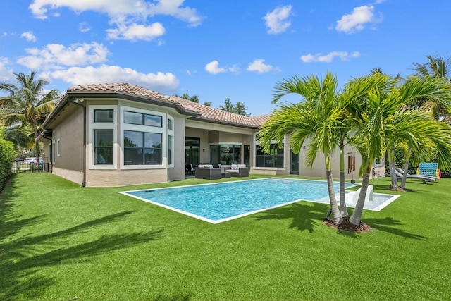16770 Burlington Bristol Ln, Delray Beach, FL 33446 - rear view of property featuring an outdoor hangout area, stucco siding, a yard, and a tiled roof