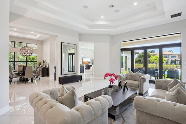 16770 Burlington Bristol Ln, Delray Beach, FL 33446 - living area featuring a tray ceiling, a chandelier, recessed lighting, healthy amount of natural light, and baseboards