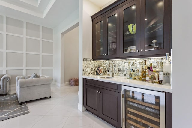 16770 Burlington Bristol Ln, Delray Beach, FL 33446 - indoor bar with beverage cooler, light marble finish flooring, decorative backsplash, and baseboards