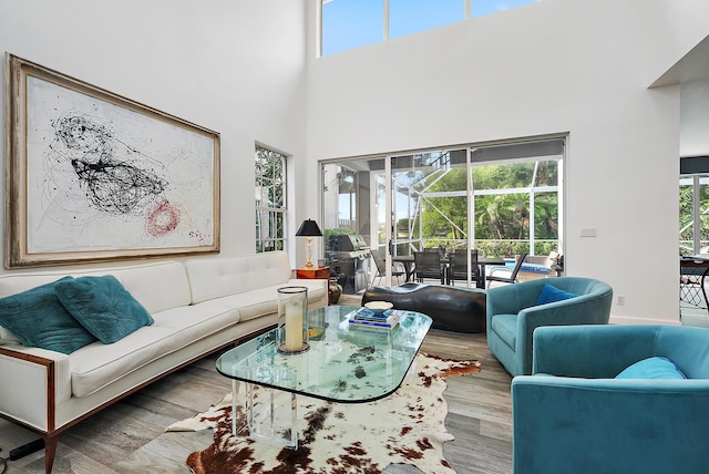 8208 Heritage Club Dr, West Palm Beach, FL 33412 - living room with wood finished floors, a towering ceiling, and plenty of natural light