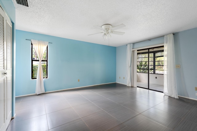 151 Pinto Palm Ct, Royal Palm Beach, FL 33411 - empty room with a ceiling fan, a textured ceiling, and baseboards