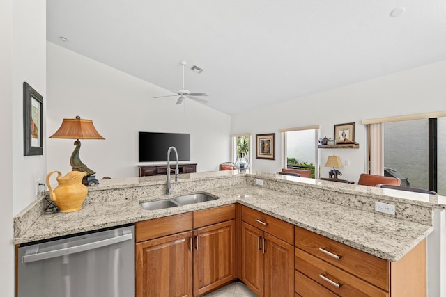 10194 N Lexington Cir, Boynton Beach, FL 33436 - kitchen with dishwasher, a sink, light stone countertops, vaulted ceiling, and open floor plan