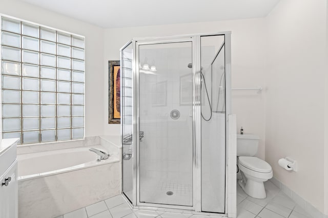10194 N Lexington Cir, Boynton Beach, FL 33436 - bathroom with a garden tub, tile patterned floors, toilet, a stall shower, and vanity