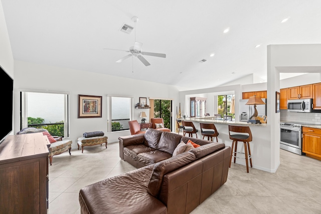 10194 N Lexington Cir, Boynton Beach, FL 33436 - living area with lofted ceiling, light tile patterned floors, ceiling fan, and recessed lighting