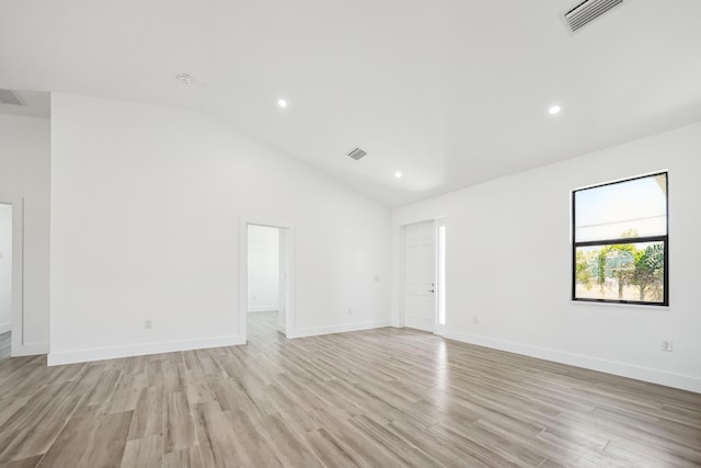 2458 NW 9th Ter, Cape Coral, FL 33993 - empty room with light wood-type flooring, baseboards, recessed lighting, and high vaulted ceiling