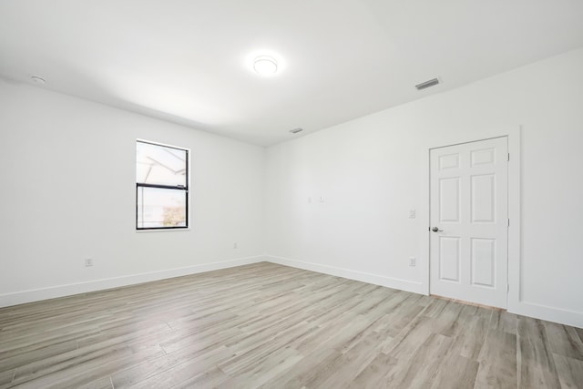 2458 NW 9th Ter, Cape Coral, FL 33993 - unfurnished room featuring light wood-style floors and baseboards
