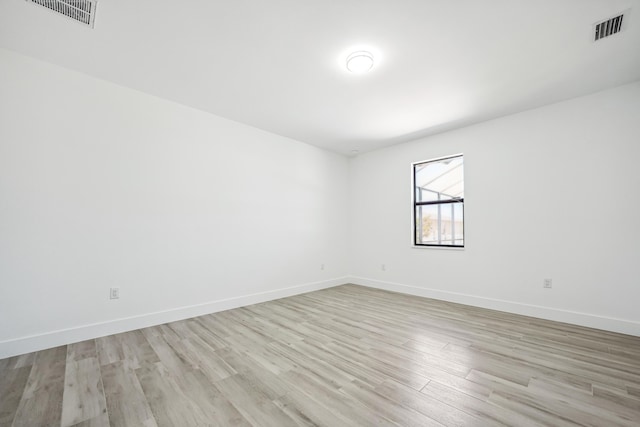 2458 NW 9th Ter, Cape Coral, FL 33993 - empty room featuring light wood-type flooring and baseboards