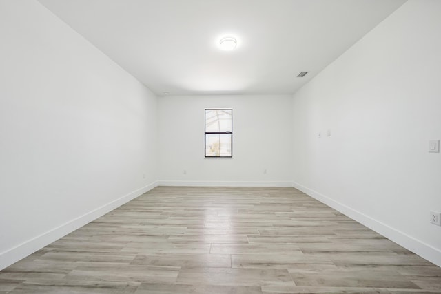2458 NW 9th Ter, Cape Coral, FL 33993 - unfurnished room featuring light wood-style flooring and baseboards
