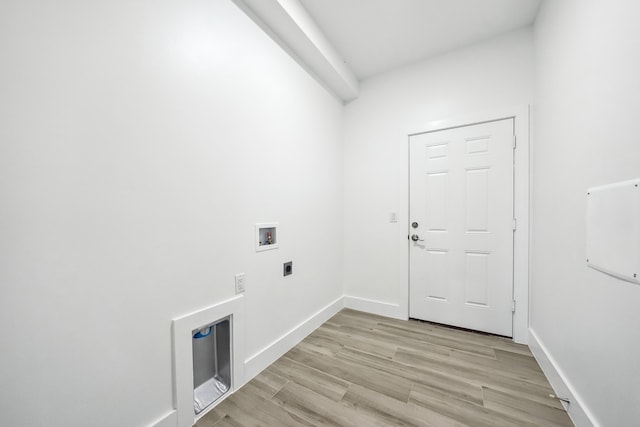 2458 NW 9th Ter, Cape Coral, FL 33993 - laundry room with hookup for a washing machine, hookup for an electric dryer, light wood finished floors, and baseboards