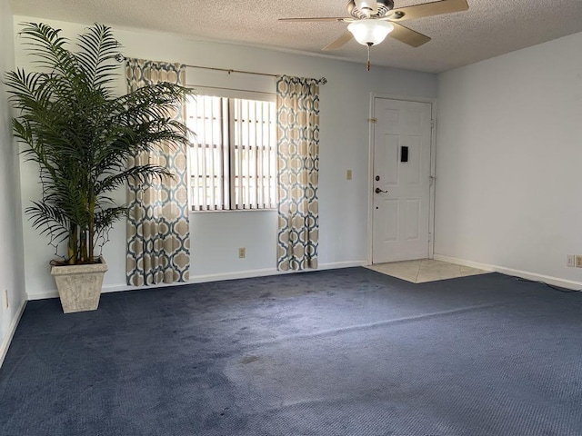 4273 Oak Terrace Dr, Greenacres, FL 33463 - carpeted foyer entrance featuring a textured ceiling, ceiling fan, and baseboards