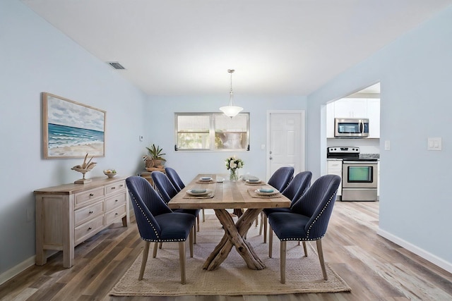 903 S 27th St, Fort Pierce, FL 34947 - dining area with wood finished floors and baseboards