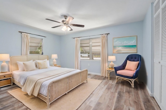 903 S 27th St, Fort Pierce, FL 34947 - bedroom with wood finished floors, baseboards, a ceiling fan, and a closet