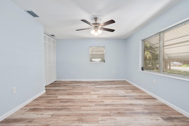 903 S 27th St, Fort Pierce, FL 34947 - empty room featuring ceiling fan, light wood-type flooring, and baseboards