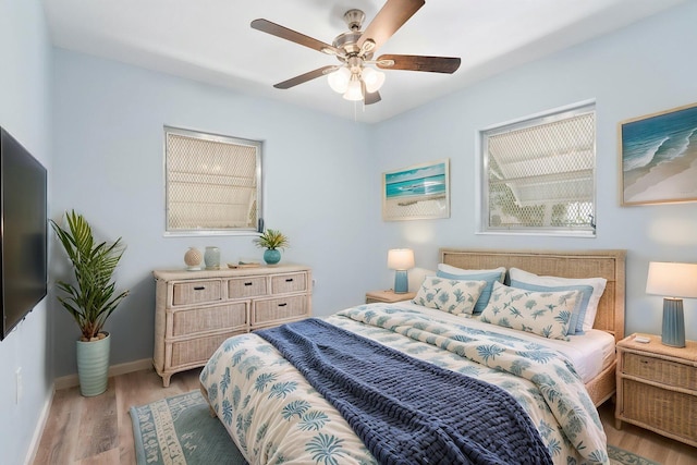 903 S 27th St, Fort Pierce, FL 34947 - bedroom with light wood-style flooring, baseboards, and a ceiling fan