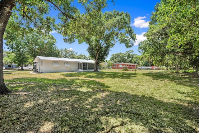 903 S 27th St, Fort Pierce, FL 34947 - view of yard with a sunroom