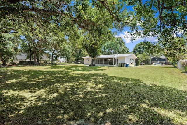 903 S 27th St, Fort Pierce, FL 34947 - view of yard with a sunroom