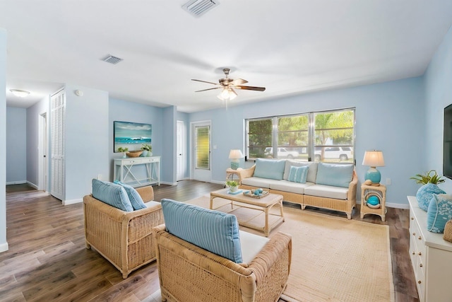 903 S 27th St, Fort Pierce, FL 34947 - living area with ceiling fan, wood finished floors, and baseboards