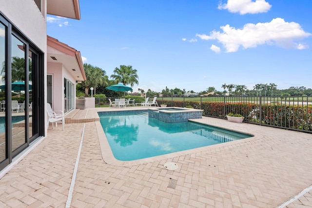 4402 SW Dundee Ct, Palm City, FL 34990 - view of pool featuring a patio and a pool with connected hot tub