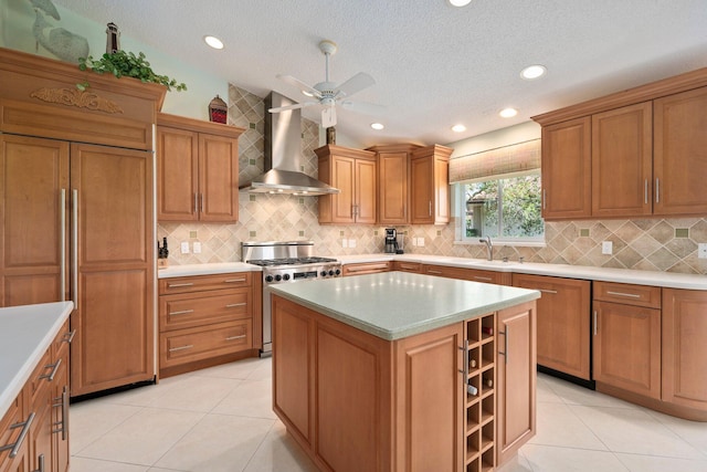 4402 SW Dundee Ct, Palm City, FL 34990 - kitchen featuring wall chimney range hood, stainless steel range with gas stovetop, decorative backsplash, paneled built in fridge, and a sink
