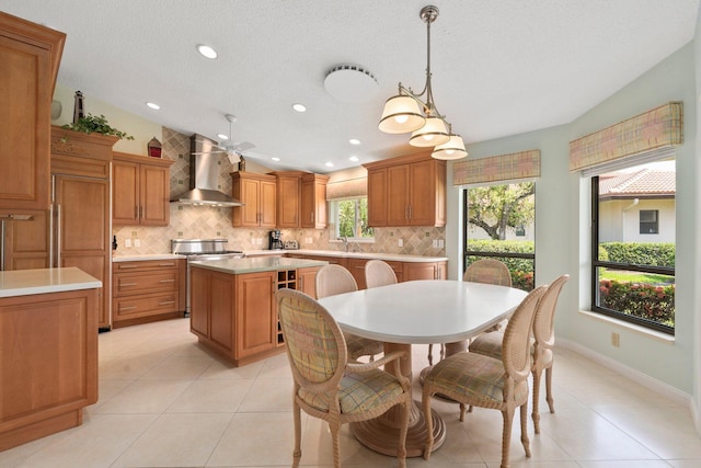 4402 SW Dundee Ct, Palm City, FL 34990 - dining space with light tile patterned floors, recessed lighting, a ceiling fan, and baseboards