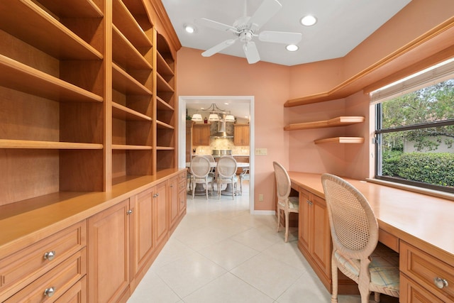 4402 SW Dundee Ct, Palm City, FL 34990 - office area with built in desk, light tile patterned floors, recessed lighting, ceiling fan, and baseboards