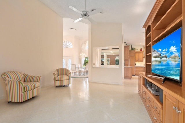 4402 SW Dundee Ct, Palm City, FL 34990 - living area featuring high vaulted ceiling, light tile patterned floors, baseboards, a ceiling fan, and a chandelier