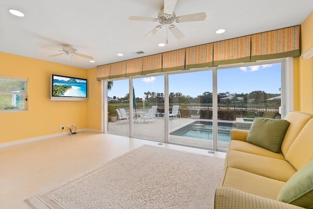 4402 SW Dundee Ct, Palm City, FL 34990 - living room with ceiling fan, baseboards, and recessed lighting