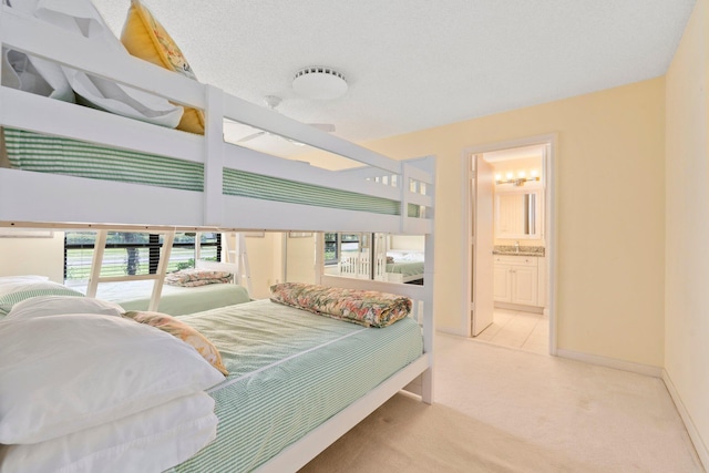4402 SW Dundee Ct, Palm City, FL 34990 - carpeted bedroom featuring multiple windows, ensuite bathroom, and baseboards