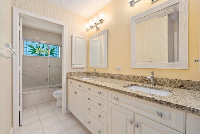 4402 SW Dundee Ct, Palm City, FL 34990 - bathroom featuring toilet, double vanity, bath / shower combo with glass door, and tile patterned floors