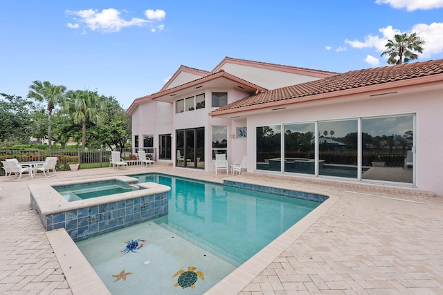 4402 SW Dundee Ct, Palm City, FL 34990 - view of swimming pool with a patio and a pool with connected hot tub