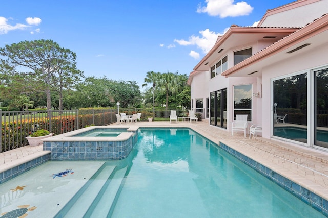 4402 SW Dundee Ct, Palm City, FL 34990 - view of swimming pool with a patio and a pool with connected hot tub