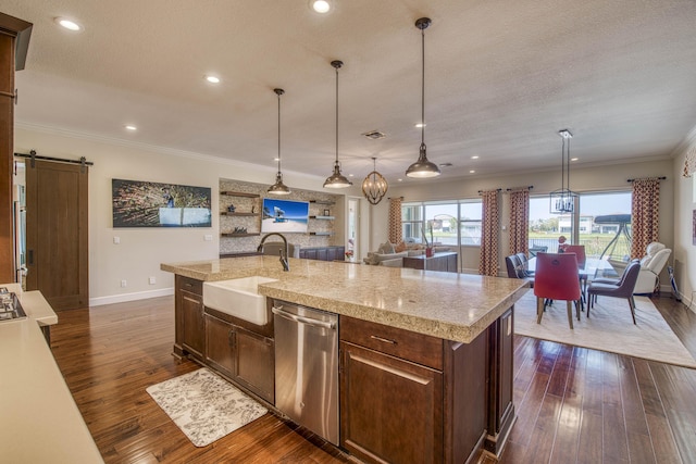 4858 Marginada Way, Lake Worth, FL 33467 - kitchen featuring stainless steel dishwasher, a sink, a barn door, dark wood-style floors, and baseboards