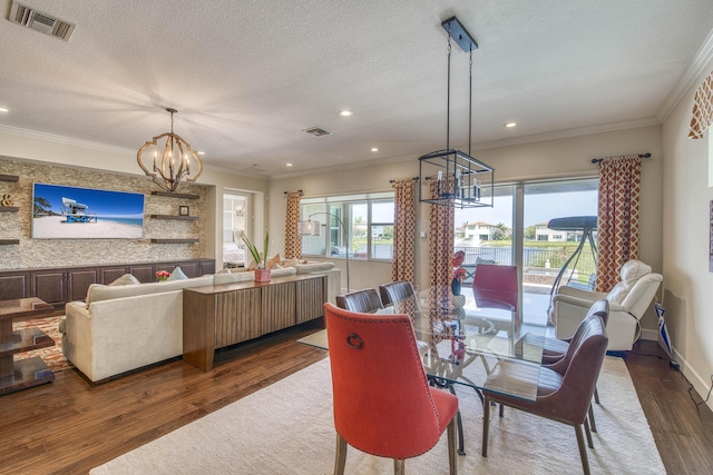 4858 Marginada Way, Lake Worth, FL 33467 - dining area featuring a chandelier, wood finished floors, recessed lighting, a textured ceiling, and ornamental molding