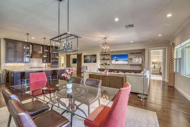 4858 Marginada Way, Lake Worth, FL 33467 - dining space with a chandelier, crown molding, dark wood finished floors, recessed lighting, and baseboards